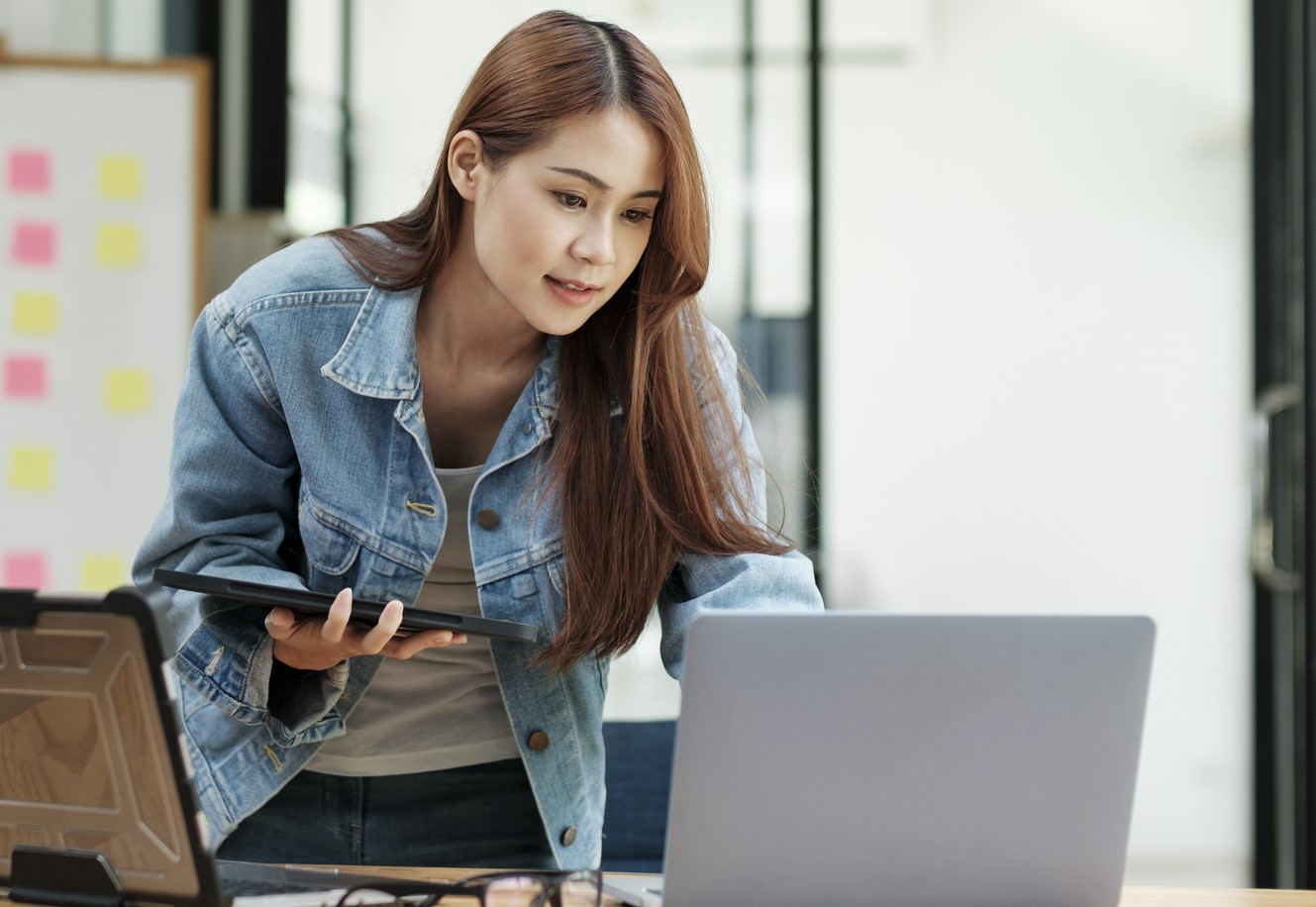 Managed Serv - Home Page- Woman looking at Laptop Screen